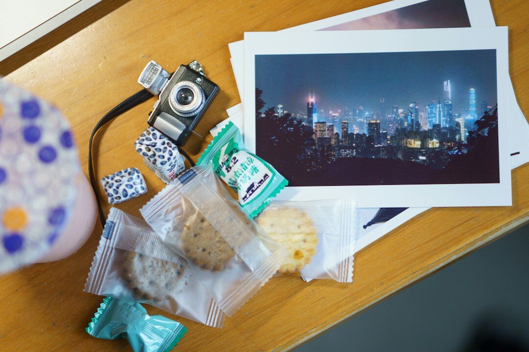 Overhead view of a photographer's desk with camera and prints