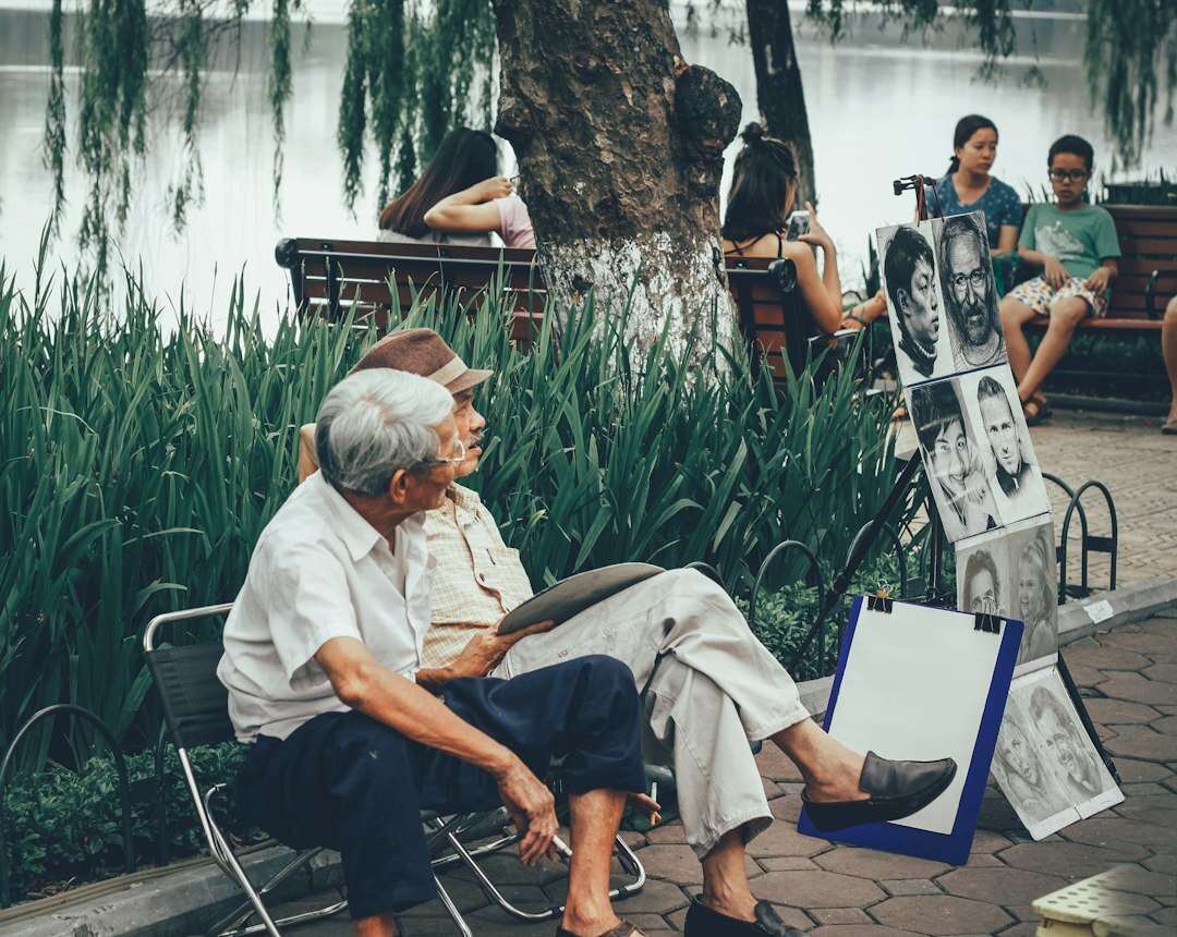 elderly and young looking at photos