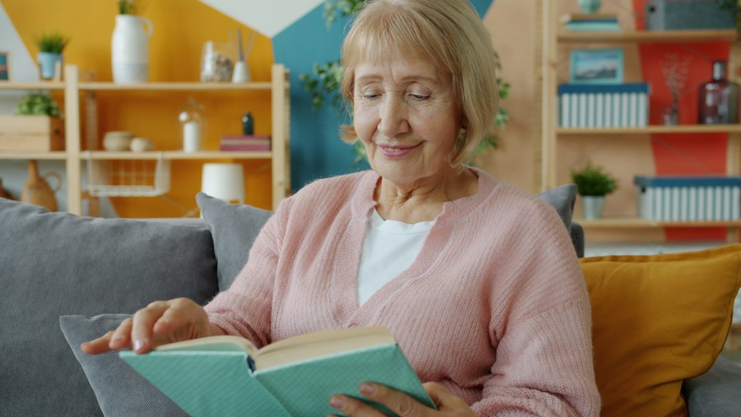 elderly woman with photo album