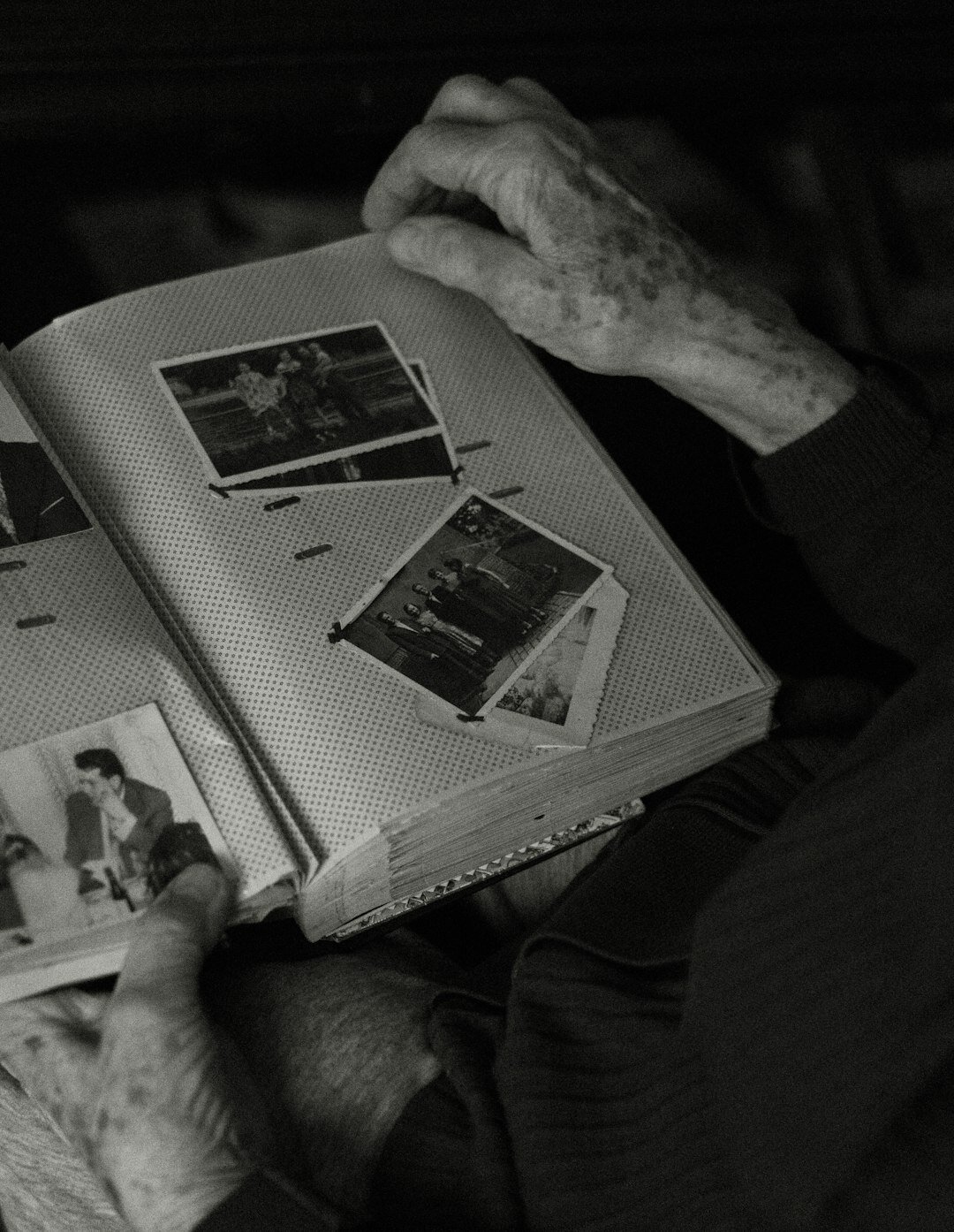 elderly person showing old photos